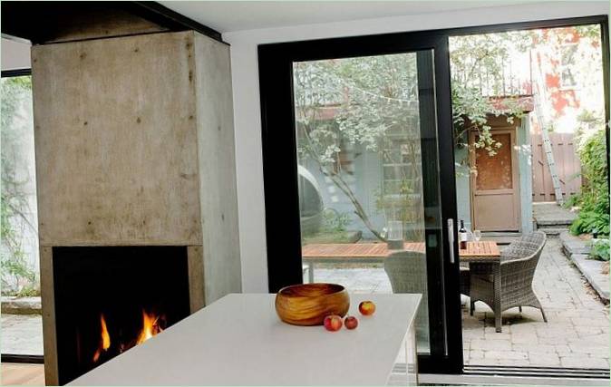 Casa di campagna Cottage de Brébeuf - camino in cemento in cucina